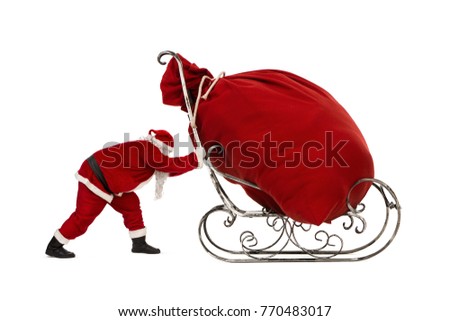 Santa Claus pushing sleigh with huge bag full of christmas gifts isolated on white background