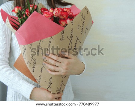 Young girl, teen girl holding  bouquet of pink, red roses. Valentine's Day, Christmas, International Women's Day, love, birthday gift. Holidays, celebration.