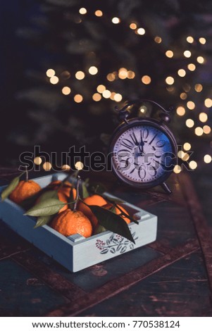 Christmas table tangerines clock bokeh