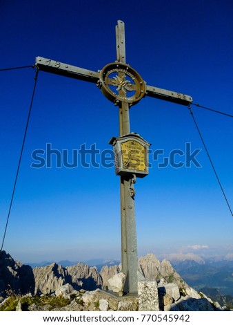 at the summit of the treffauer in the austrian alp region Wilder Kaiser with a impressiv background view and a very blue, clear sky