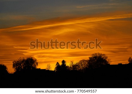 Colorful dramatic sky with cloud at sunset.