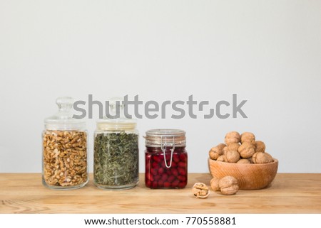 glass jars of various dried fruits, and mushrooms 