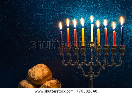 Image of the Hanukkah Jewish holiday with a menorah and burning candles