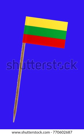 Tooth pick wit a small paper flag of Lithuania on a Tooth pick wit a small paper flag of Mauritania on a blue screen for chromakey screen for chromakey 