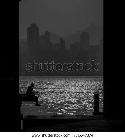 Black and white picture Silhouette Fisherman Backgrounds city sea-Evening light