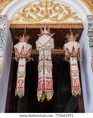 Traditional Thai lantern from the paper is hanging on the church entrance for wealth and good luck,northern of Thailand.