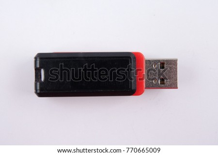 Black and red flash drive isolated on white background.