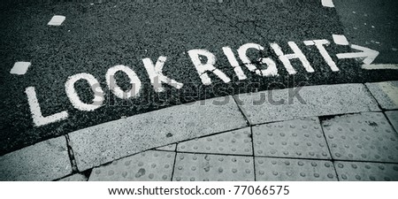 look right sign painted on the road