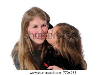 Little girl kissing mother isolated over a white background.