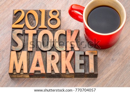 2018 stock market word abstract in vintage letterpress wood type with a cup of coffee