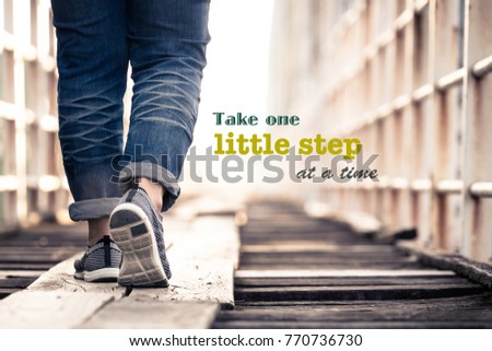 Take One Little Step At a Time  - inspiration quote on concept photo, woman walking on the wood bridge