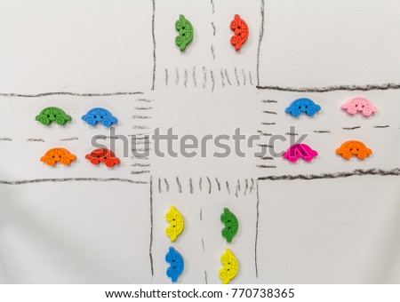Colorful tiny cars depicting transportation and traffic for basic school kids safety education or the business, travel or transportation sectors.   