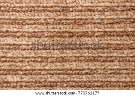 Brown and beige strips on knitted large viscous woolen fabric