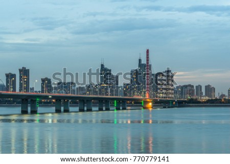 modern landmark bridge over the river at twilight