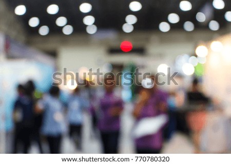 Blurred, defocused background of public event exhibition hall, business trade show concept, education