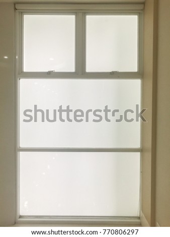 Abstract background texture or wallpaper of closing window with brown wooden frame inside a modern building in vertical view