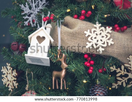small wood house with Christmas deorations
