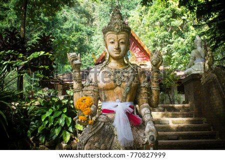 A statue of the Hindu god Rama, Narayana or Vishnu Temple, backgrounds, tree, ladder, and Chiang Mai. Thai