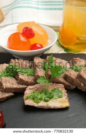 Boiled beef meat with green sauce and mustard