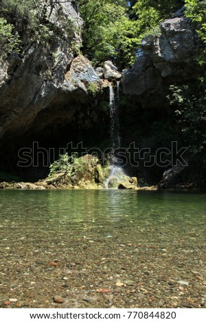 Waterfall and clear water of river, taken in Aegean island in Greece