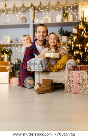 Picture of father,son and girl with gift background
