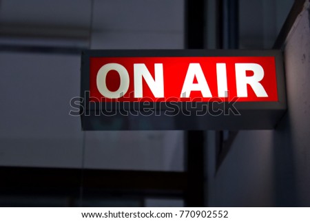 On air glowing sign over the door in front of the classroom. Live tv or radio station. Live tv and radio broadcast channel concept.
