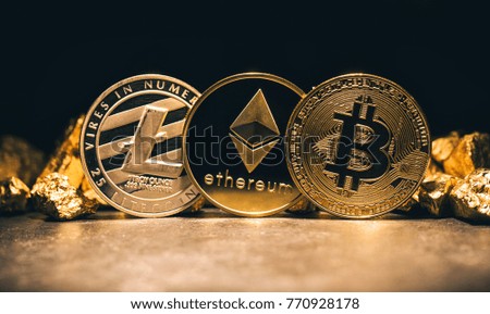 Golden cryptocurrencys Bitcoin, Ethereum, Litecoin and mound of gold - Business concept image Royalty-Free Stock Photo #770928178