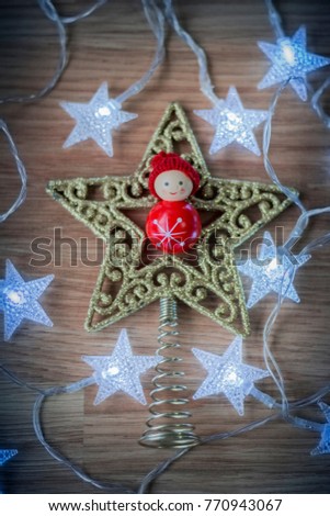 Christmas decoration with lights, red, and white toys