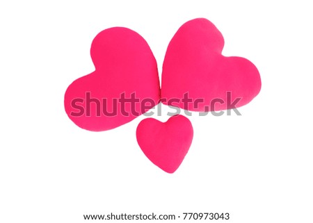 Three pink heart pillow on a white background