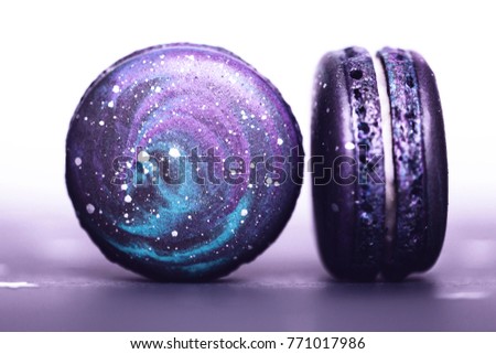 Couple of Ultra Violet macaroos with space pattern, macro. Color of the year 2018. Royalty-Free Stock Photo #771017986