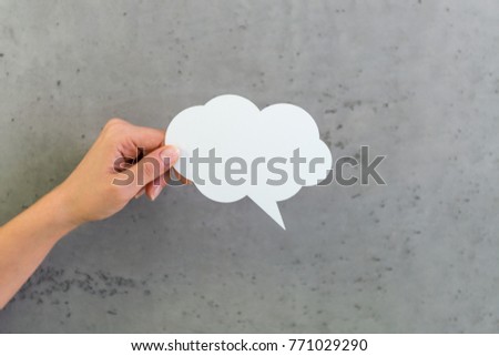 Hand holding Text Bubbles
