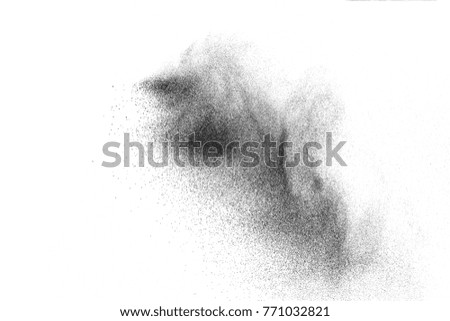 Black powder explosion on white background. Abstract black dust splatter on white background. Black particles of charcoal splash on white background.