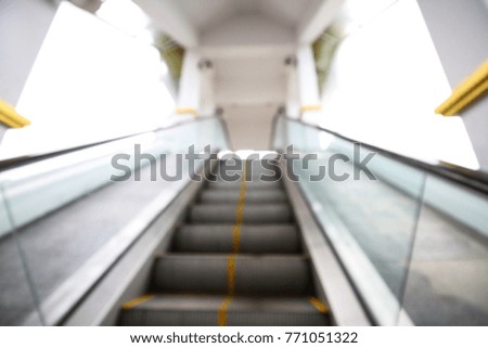 Abstract blur an escalator inside a building. 