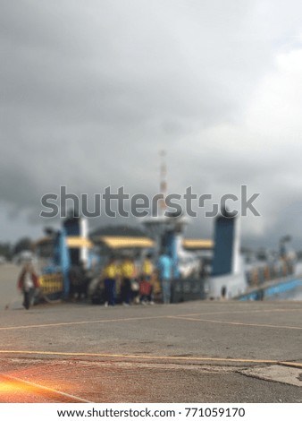 Blurred photo of Harbor transportation Car and people From Boat crossing Songkhla Port in thailand