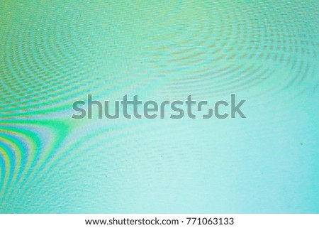 An abstract dark turquoise blue background with waves, interference, moire