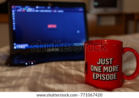Watching series with a cup of tea. Just one more episode 3 Royalty-Free Stock Photo #771067420