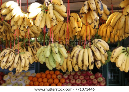 Banana fruits hanging in a fruit market in Asia