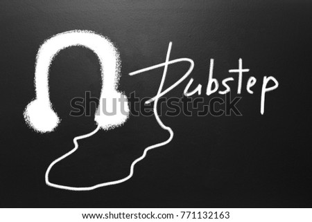 Dubstep text and Drawn earphones on blackboard