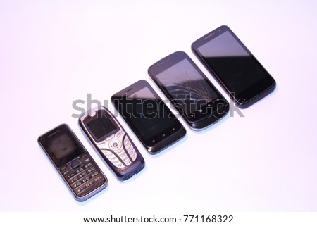 Old broken mobile phones. Close-up. Isolated on white background. Isolate.