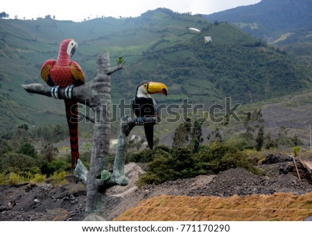 Statues of toucans in the entrance to the city of Baños de Agua Santa, Ecuador
