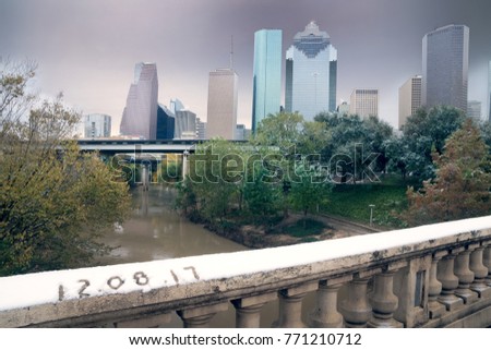 Snow fell in Houston, on the rails of the bridge in the snow written date 12.08.17
