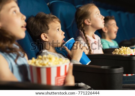 Shot of a little boy sipping his drink during movie premiere at the cinema kids children childhood elementary educational hobby leisure cartoons activity entertaining thirsty coke concept