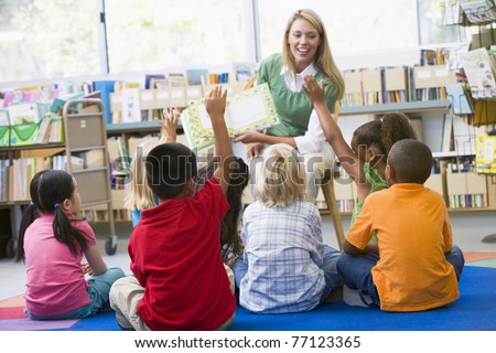 Students in class volunteering for teacher Royalty-Free Stock Photo #77123365