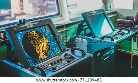 Ship Radar inside bridge room. Shim control room bridge monitor. Navy map yellow monitor Royalty-Free Stock Photo #771239485