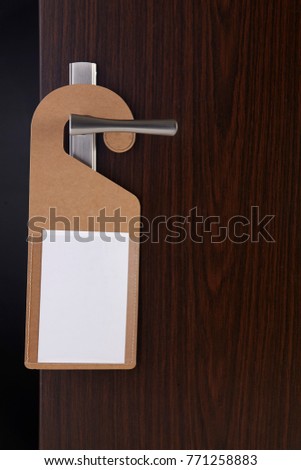 blank door sign hanging at door handle