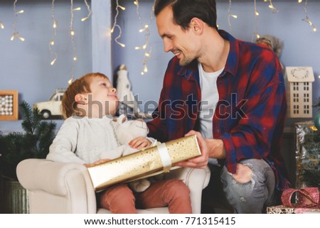 New Year's image of son and father with gift