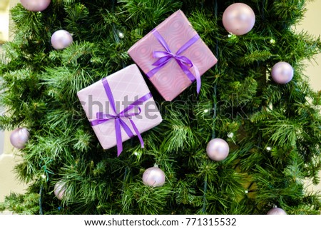 Image of Christmas background with spruce, purple boxes