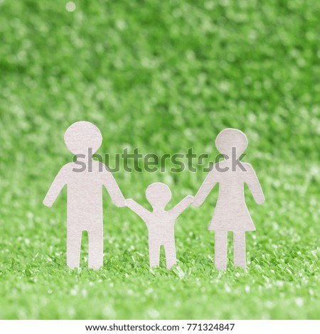 Abstract model family on green grass blurred background. International Family day concept.
