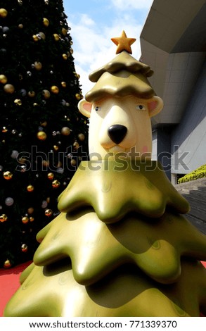 Bear and Christmas tree