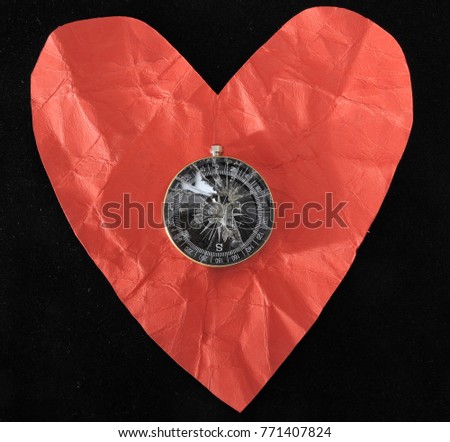Orientation in Love - Red Paper Heart and Compass on a black Background